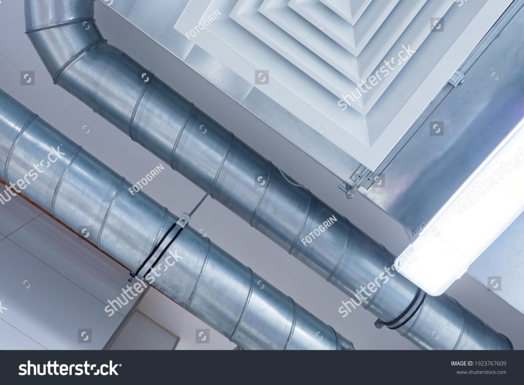 stock-photo-industrial-ventilation-system-and-the-lamp-on-the-ceiling-ceiling-of-the-working-room-bottom-view-1923767609